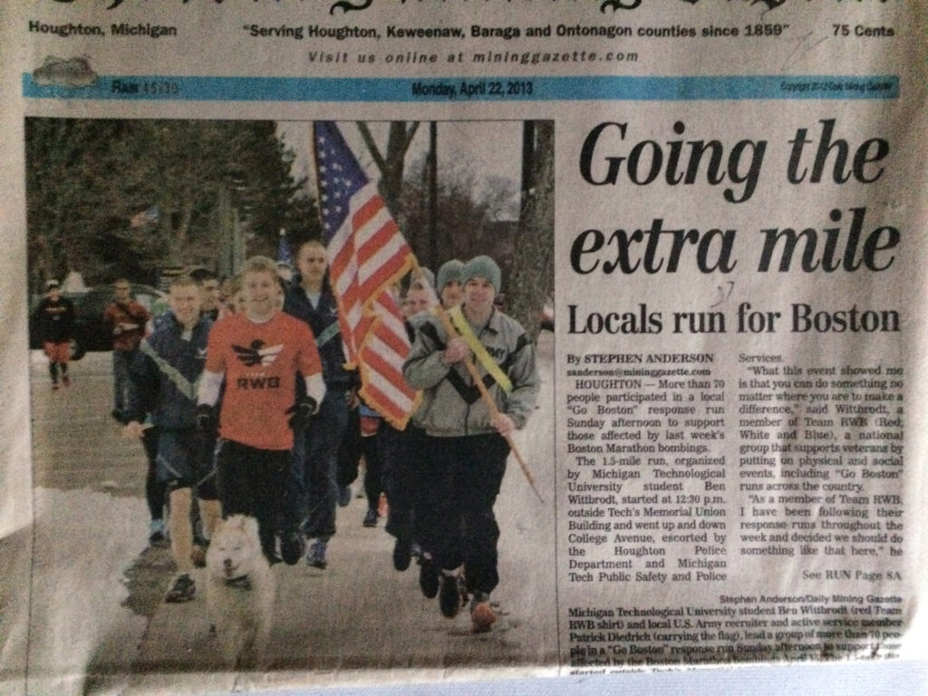 Front page of a local newspaper, with Patrick Diedrich leading a group of ROTC students on a run.