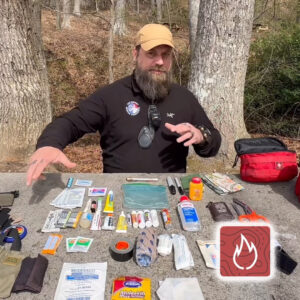 Photo of JJ Morris of Fuel the Fires with his Med Kit essentials.