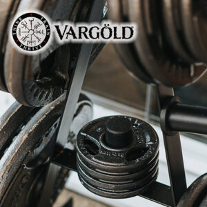 Barbell weights on a weight stand.