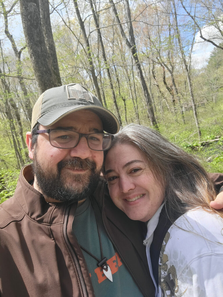 Nick Italiano in the forest with his wife.